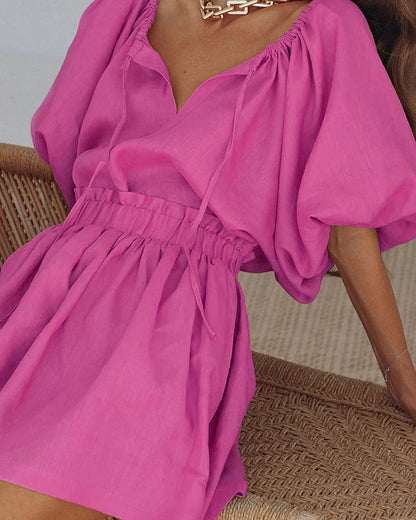 Conjunto falda corta rosa de algodón y lino con mangas abullonadas 